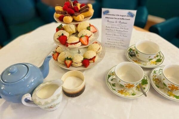 Selection of cakes and traditional tea cups on a table