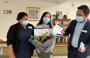 Coxhill Manor Care Home Manager presenting Long Service Award to Sharon for 15 years service at the home