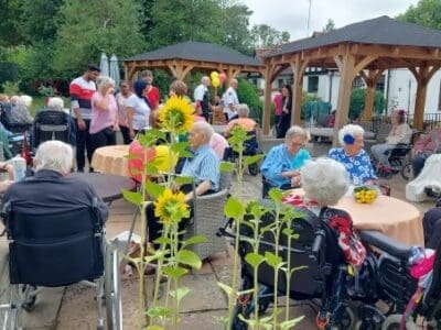 Coxhill Manor Care Home residents, family and local community enjoying their Summer BBQ in July 2023