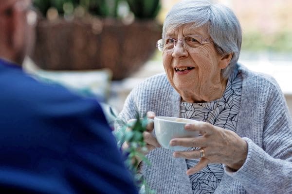 Resident having a chat with carer