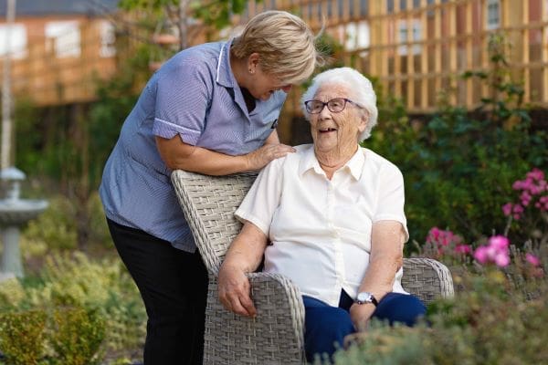 Resident with carer in garden