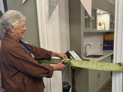 Deputy Mayor Cllr Imogen Makepeace cutting the ribbon at Claydon House Care Home Relaunch Event on 31st October 2023